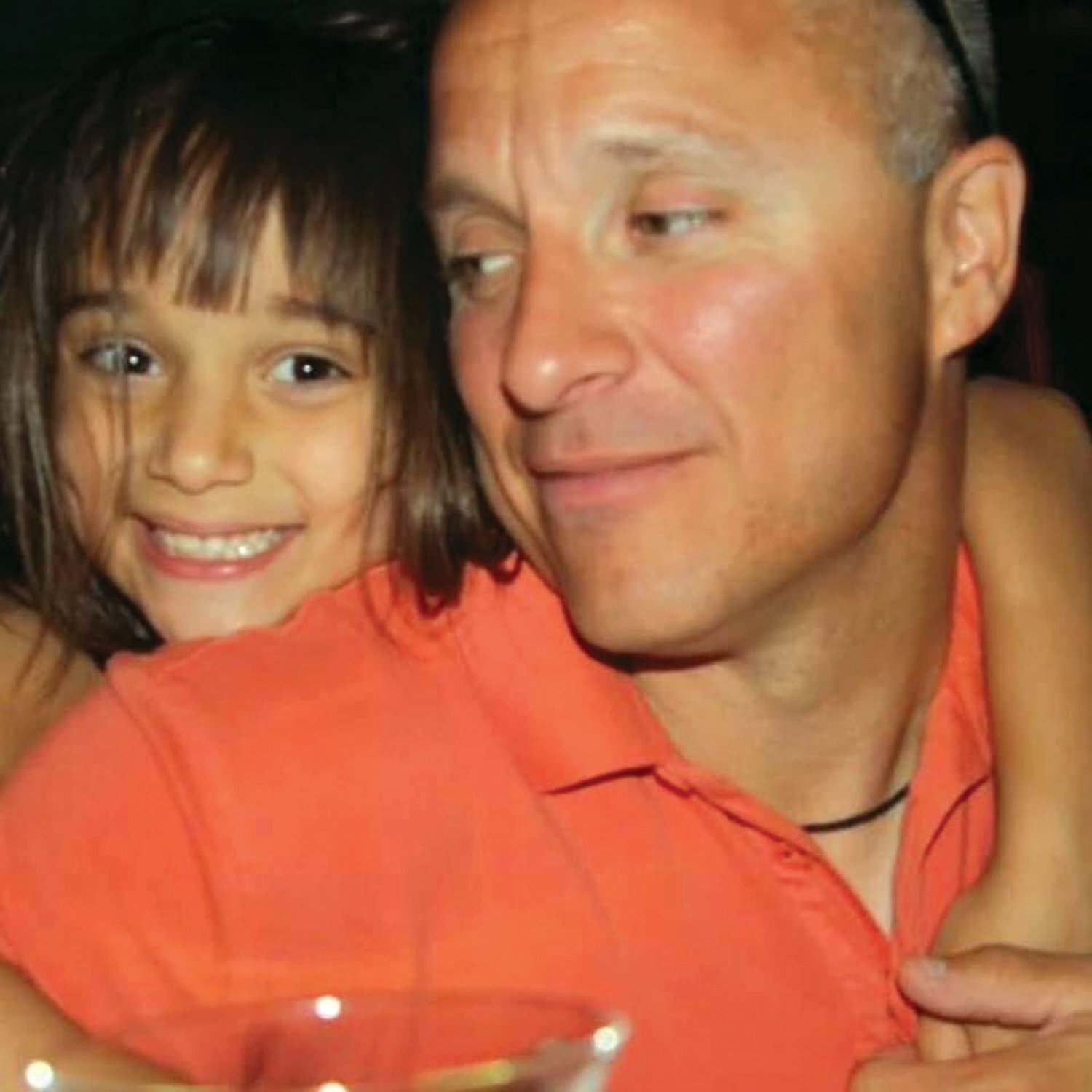 Olivia Passaretti poses for a photo with her late father, Michael, who passed away in 2015 at the age of 46, when Olivia was just 11 years old.